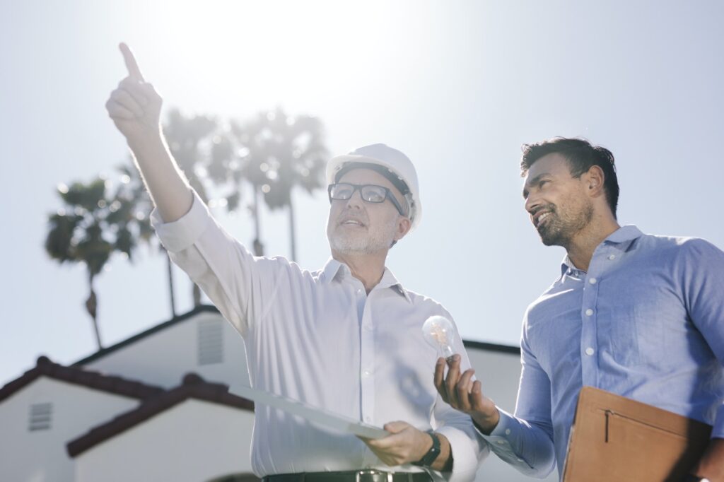 Eco-friendly engineering team with the solar panel